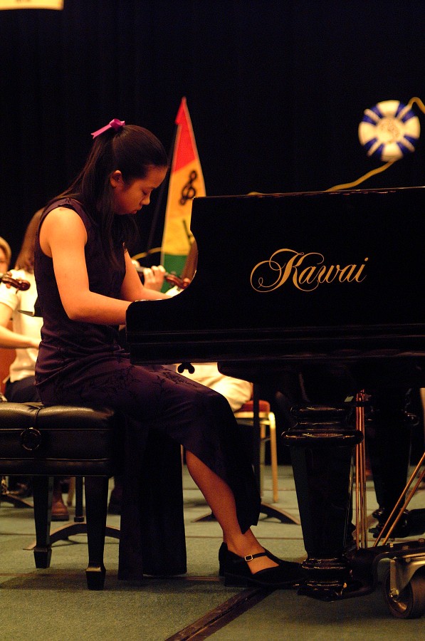 Concerto competition winner Amy Yang performs with the Suzuki Young Teachers Orchestra on Saturday night at the 2002 SAA Conference.