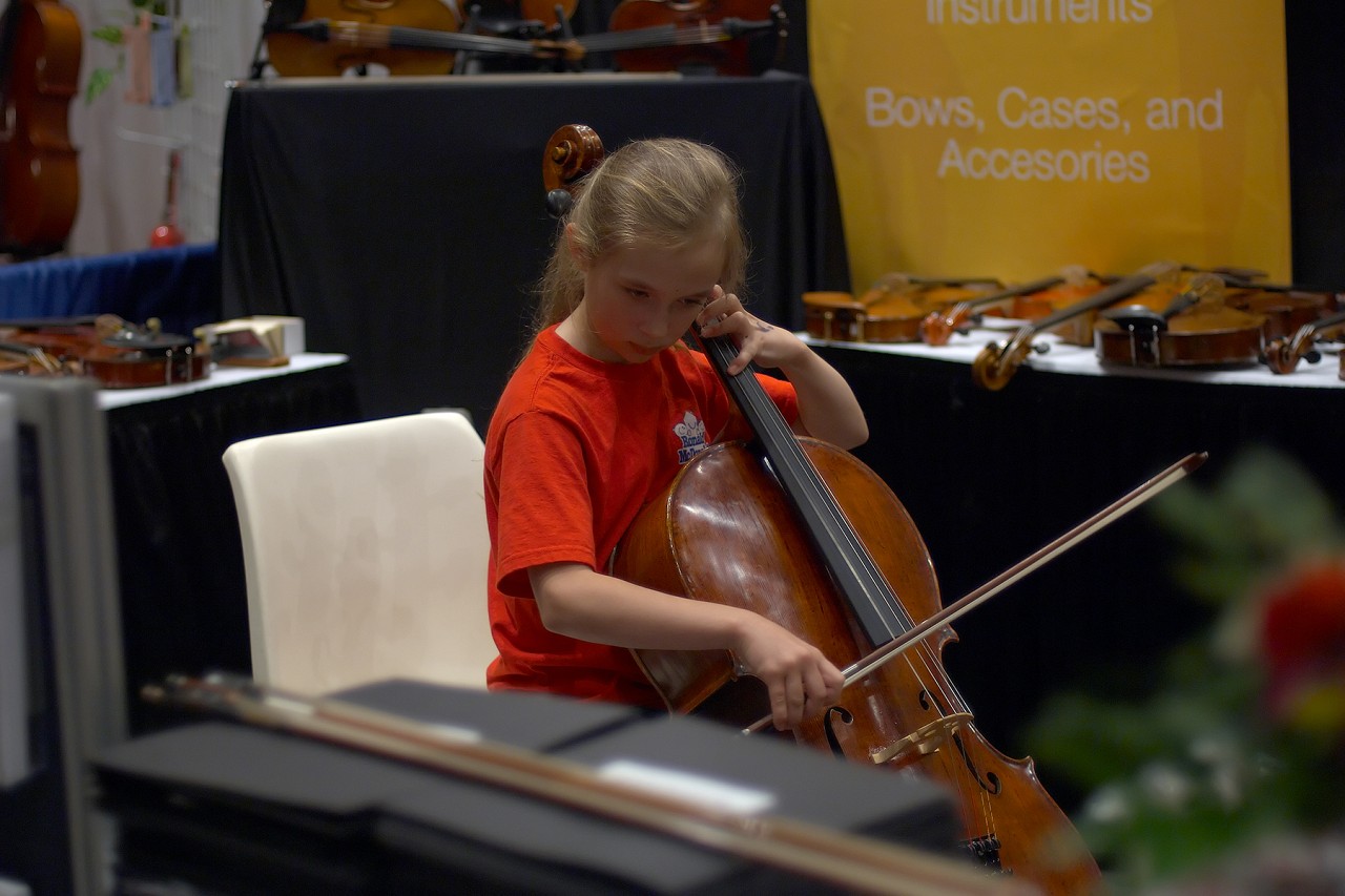 Trying out a cello at the 2006 SAA Conference exhibits