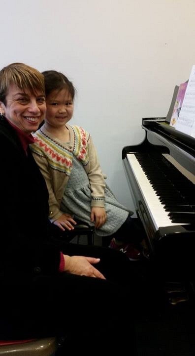 Lisa Sun (6) at the piano lesson