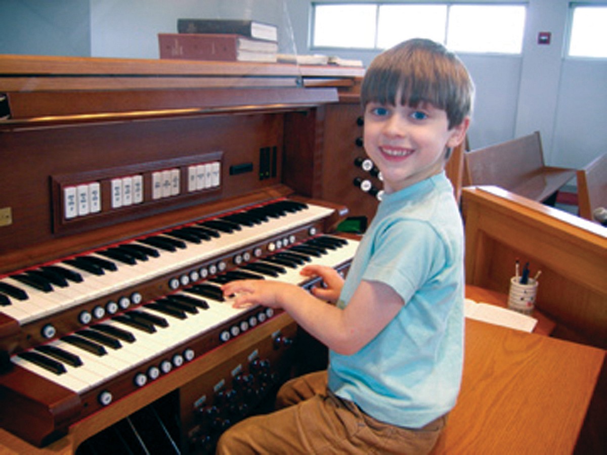 Student Oliver at the organ