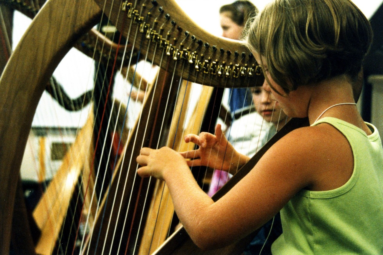 Young harpist as Peaks to Plains Suzuki Institute in 2002
