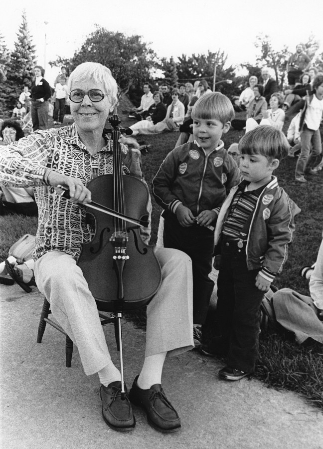 Yvonne Tait demonstrates on a student’s cello