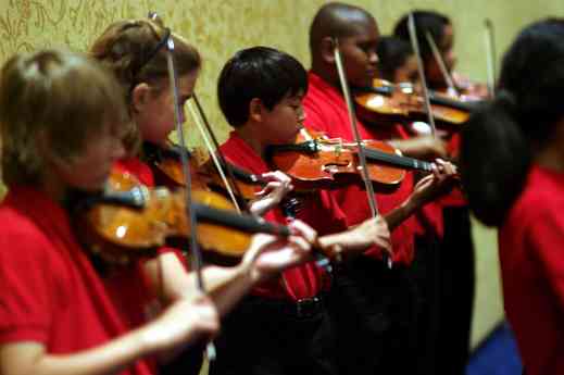 Parker Elementary Suzuki Strings performs at the opening reception