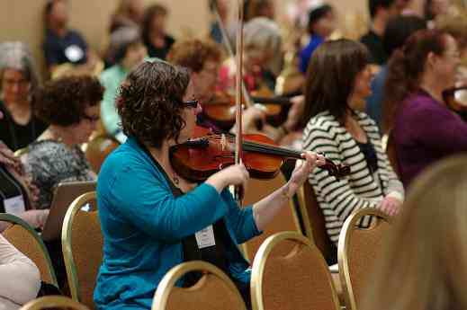Playing along with a violin session at the 2012 conference