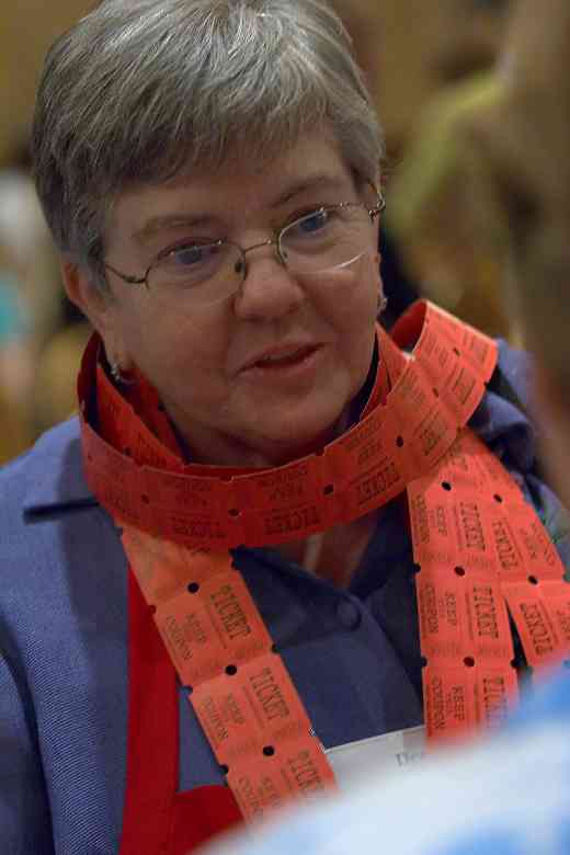 Board member Dee Martz covered in raffle tickets at the 2006 SAA Conference