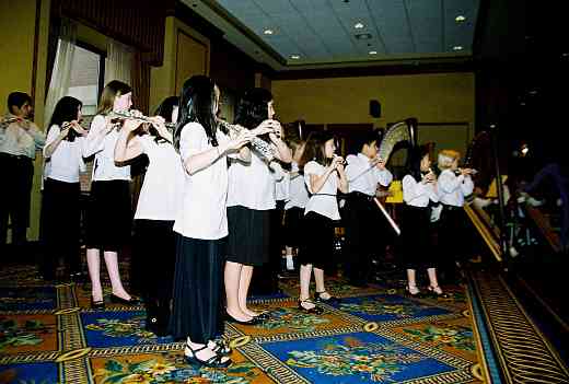 Suzuki flute and harp choir performance.