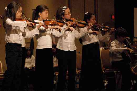Young violinists perform in the Latin American Suzuki Ensemble at the 2008 SAA Conference