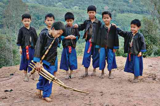 Hmong Tsai Boys, New Year Festival, playing the Gheng, Phongsali, Laos, 2005