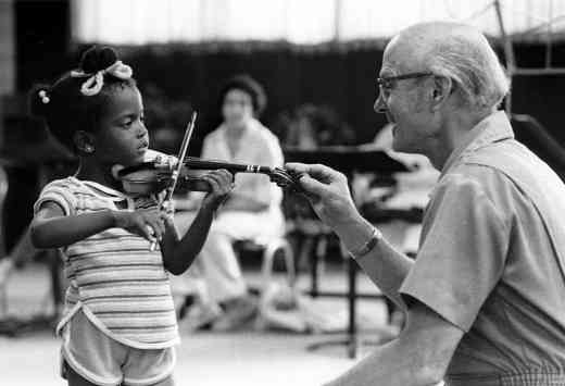 John Kendall teaching a young violin student