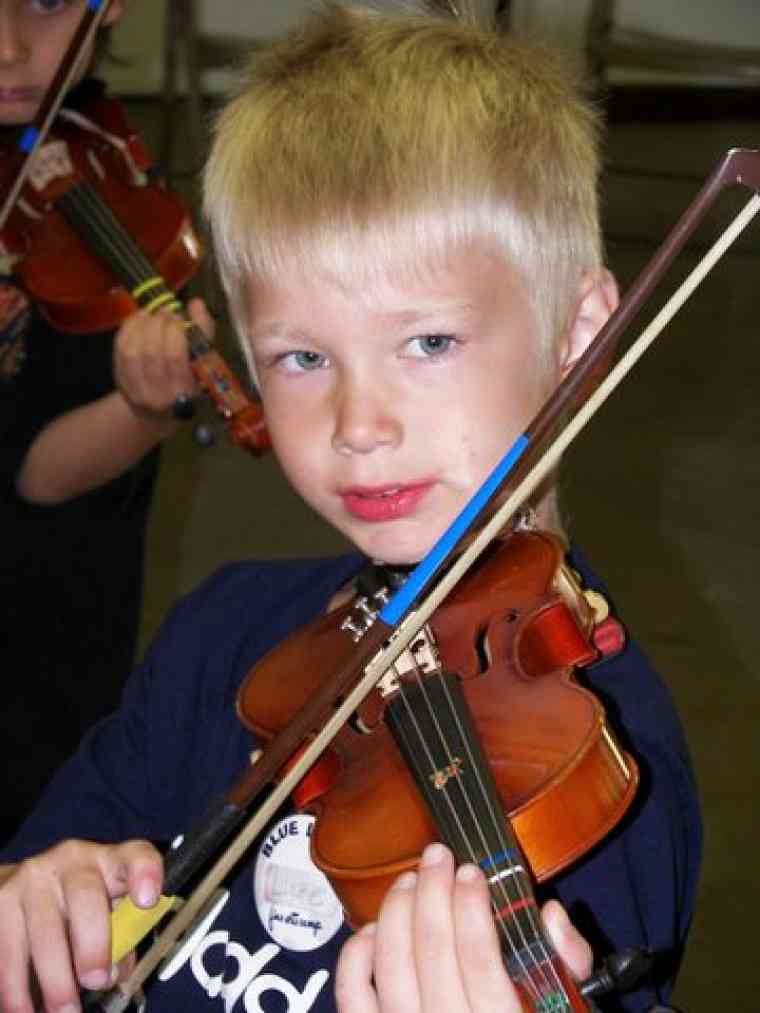Violin student at Blue Lake Suzuki Family Camp