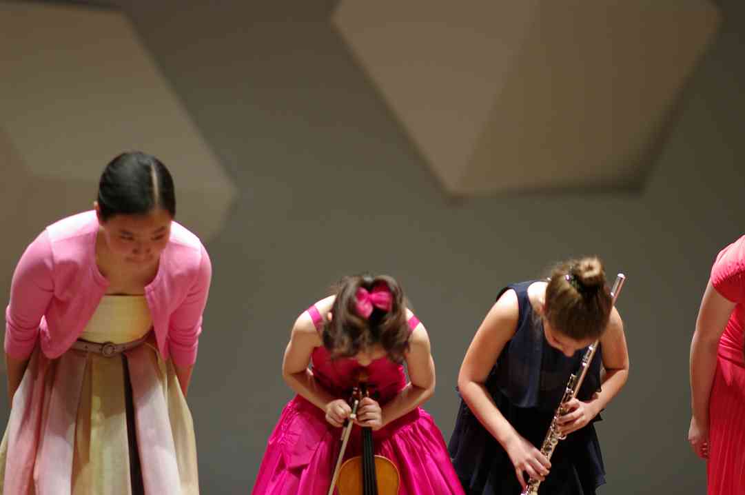 Sarafina Oh, Yesong Sophie Lee, and Nadira Novruzov take a bow in the Kaleidoscope Concert