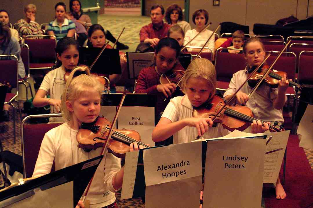 SYOA violin section hard a practice at the 2002 SAA Conference.