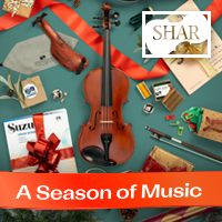 Advertisement: Holiday photo of violin framed in center with accessories scattered around.