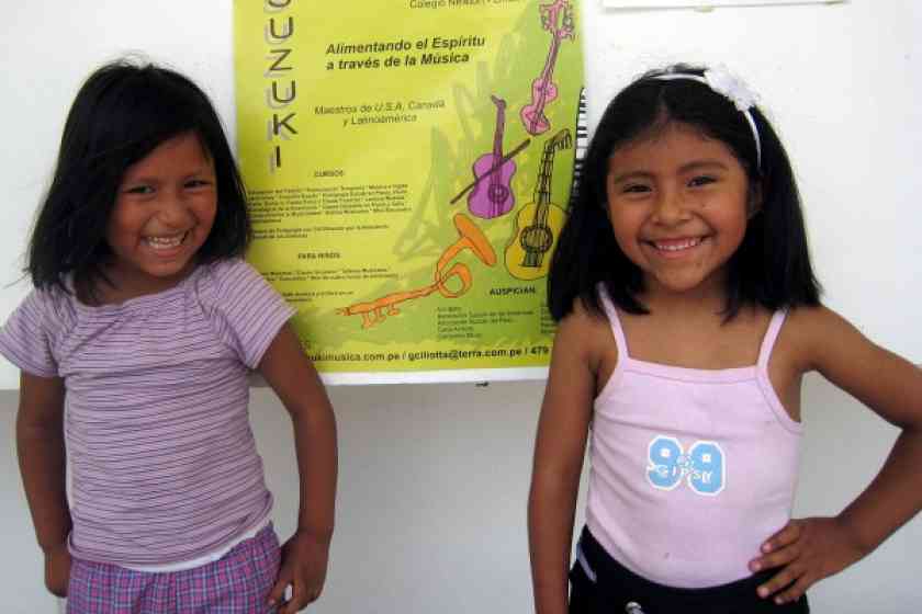 Two cousins with the Peru Festival poster