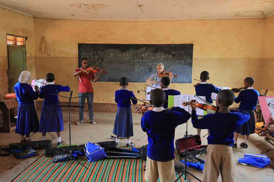 The author (front right) teaching with Michael Boaz (front left) at the Majengo Elementary School in Moshi, Tanzania. Photo by Allan Blunt.