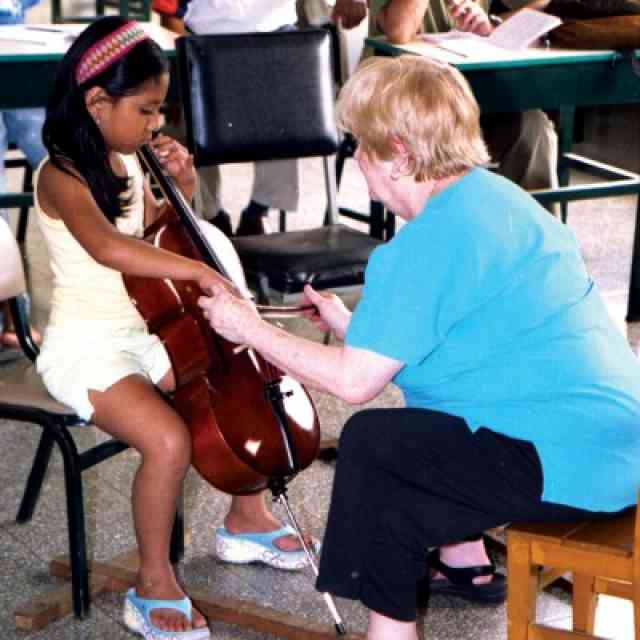 Carol Tarr and young cellist in Peru