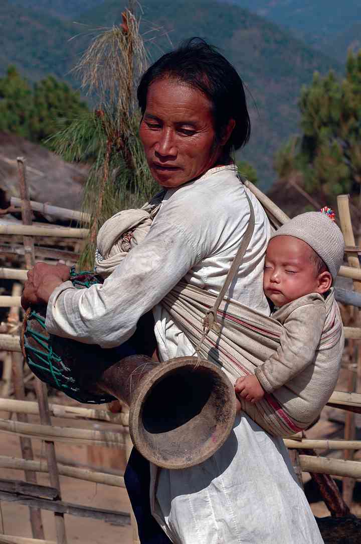 Lahu Shi man and grandchild, Harvest Festival in Keng Tung, Myanmar/Burma, 2005