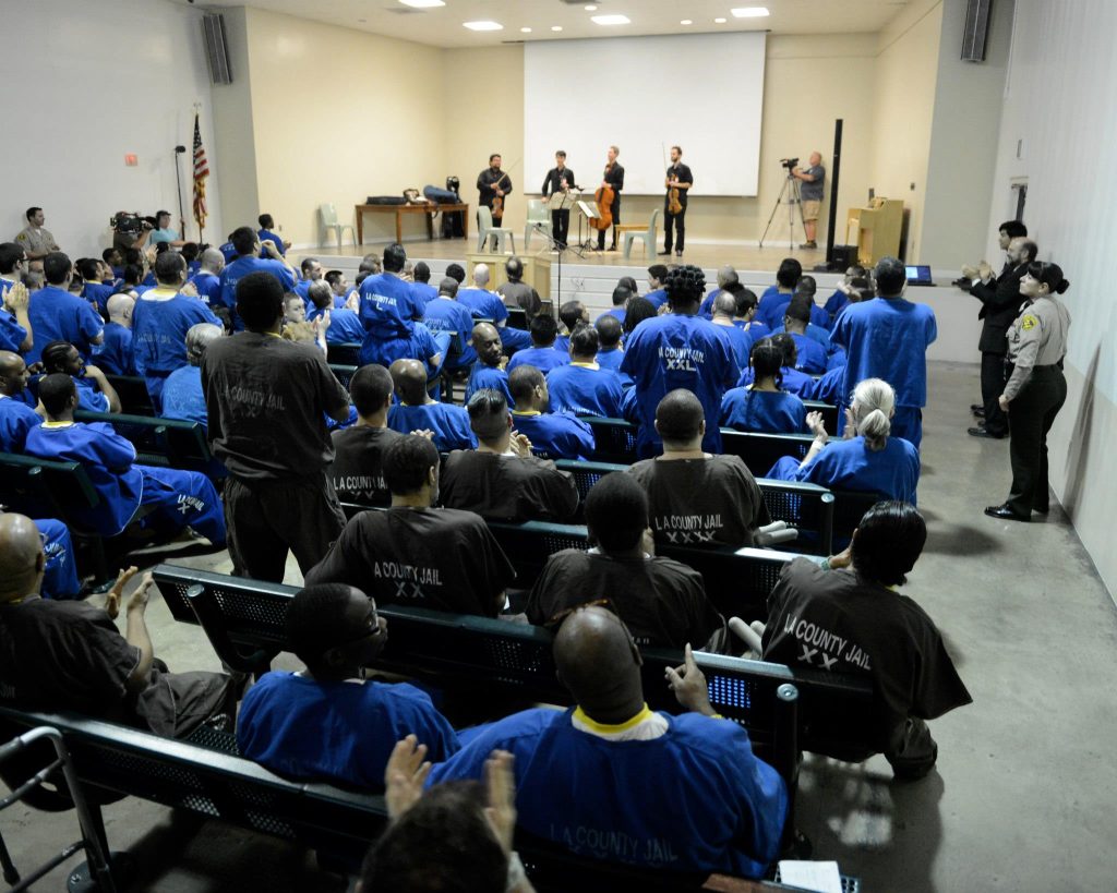 Vijay Gupta performing string quartets at the LA County Jail. Photo by Cooper Bates.